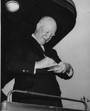 Ike signing autographs